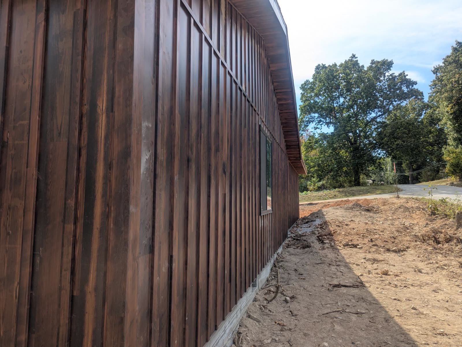 Close view of the wood siding along the side wall